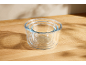 Set of glass mixing bowls on a wooden countertop.