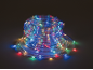 Coiled multi-colored LED rope lights glowing in the dark.