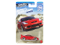 Red toy car in packaging with a Fast & Furious theme.