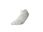 White ankle sock with textured knit on a black background