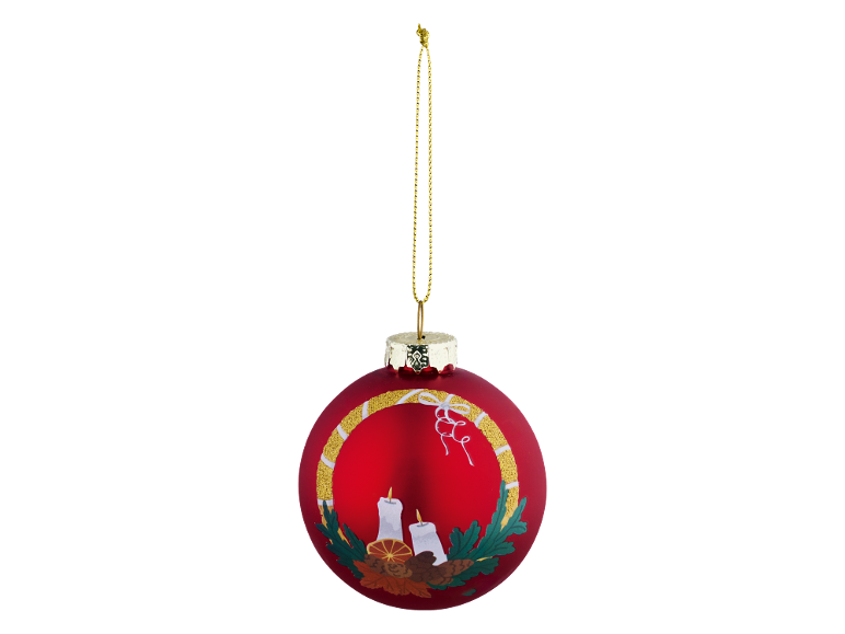 Red Christmas bauble with candles, leaves, and pinecones, hanging from a gold string.