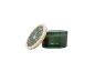 Winter Walk scented candle in a green glass jar with a wooden lid