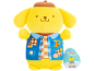 Yellow plush toy in a blue vest with patches and a brown beret.