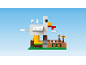 A toy chicken coop with an egg and chick dropping mechanism.
