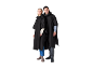 Two people wearing black rain ponchos, standing on a white background.