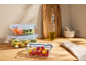 Silvercrest glass containers with fresh vegetables and pasta on a kitchen countertop.