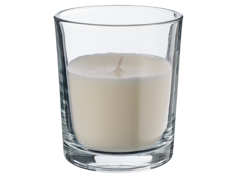 White candle in a clear glass tumbler.