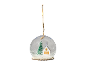 Christmas snow globe ornament with a house and tree inside, hanging by a string.