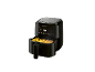 Black air fryer with a basket of golden french fries, displaying 180°C.