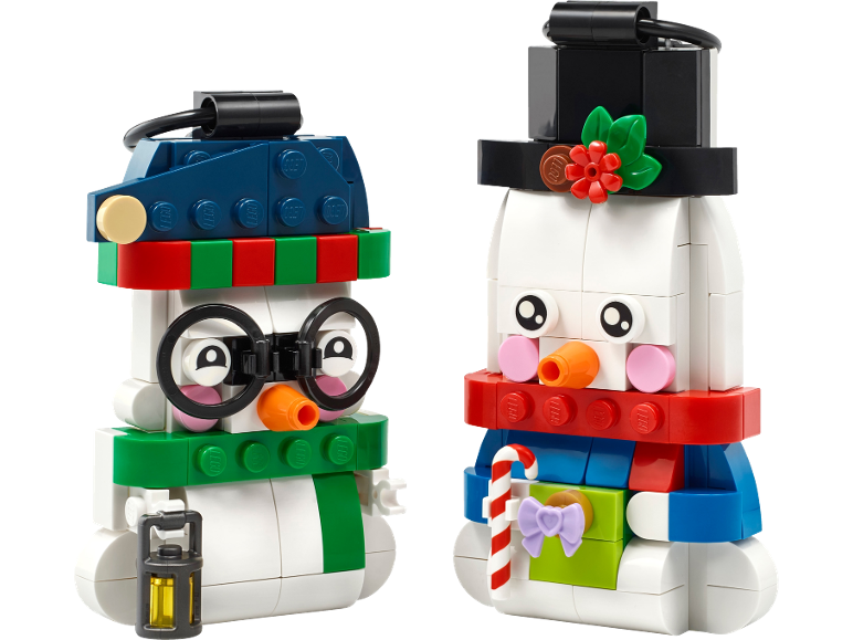 Two colorful toy brick snowmen as Christmas decorations.