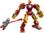 Red and gold toy robot with small gray figure shooting a red beam.