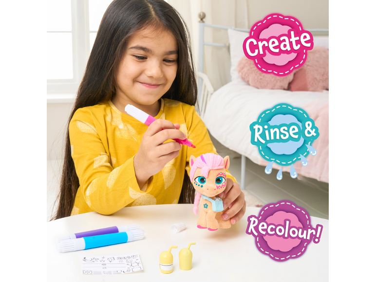Girl coloring a toy pony with the included felt-tip pens.