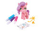 Colorable pink toy pony with felt-tip pens, stickers, and accessories.