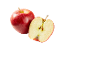 Whole red apple and a half-cut apple with seeds, on a black background.