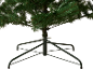 Artificial Christmas tree with a dark green metal stand on a black background.
