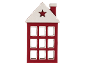 Red and white wooden house decoration with a star cutout on the roof.