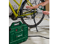 Green compressor inflating a bicycle tire.