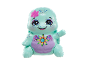 Turquoise turtle toy figure with floral patterns and a smiling face.