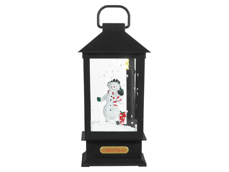 Black Christmas lantern with a snowman, a gift, and 'CHRISTMAS' text.