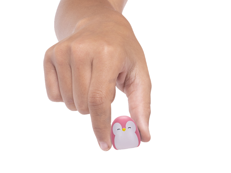 Hand holding a pink penguin toy