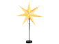Yellow paper star lamp on a black stand