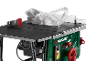 Green and black table saw with a transparent blade guard and red controls.