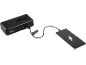 Black power bank charging a smartphone via USB-C cable.