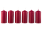 Six dark red cylindrical candles with white wicks on a black background.
