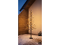 Decorative LIVARNO LED tree on a snowy terrace. [AI-generated image]