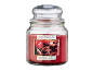 Apple cinnamon scented candle in a glass jar with a lid.