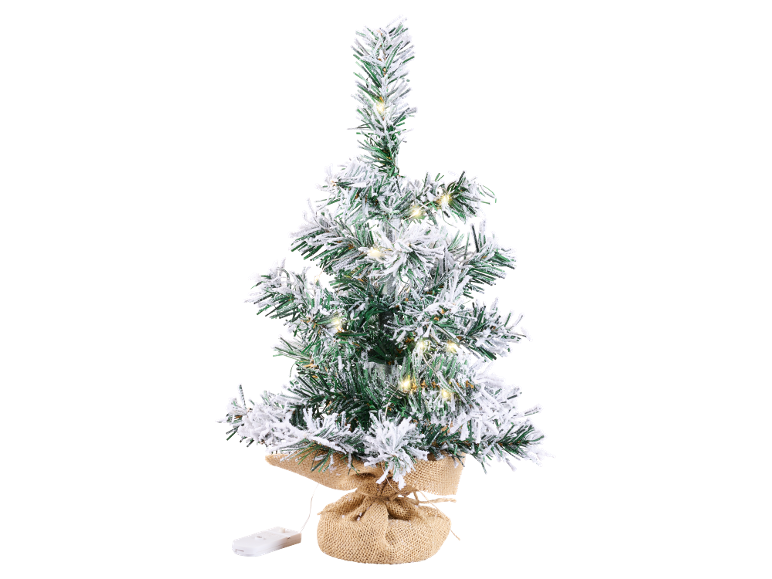 Small artificial Christmas tree with snow and LED lights in a jute pot.