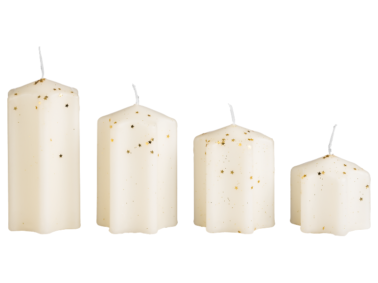 Four white candles of varying sizes with gold star-shaped glitter.