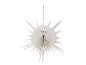 White paper star hanging decoration against a black background