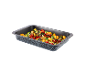 Baking dish with gnocchi, cherry tomatoes, spinach, and cheese.