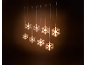 Christmas decoration with illuminated snowflakes hanging against a dark background.