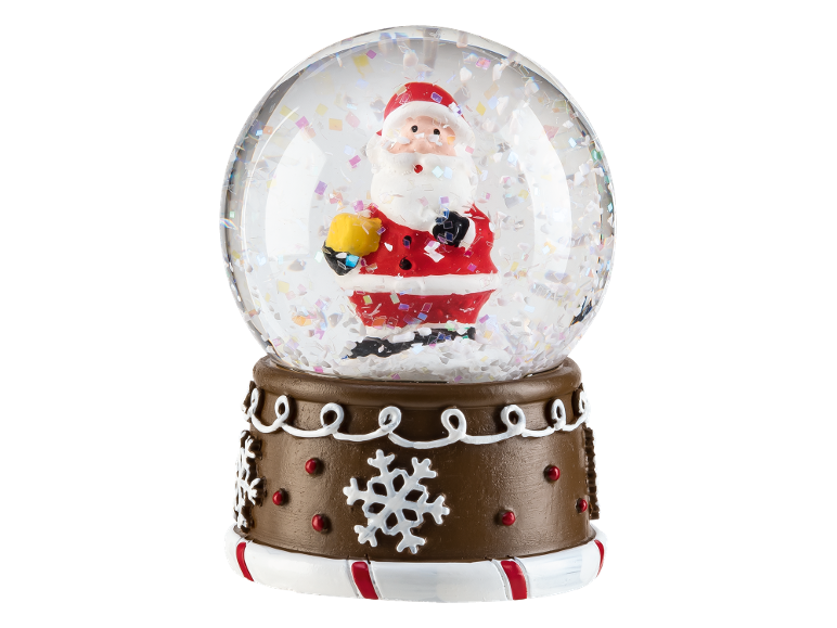 Christmas snow globe with Santa Claus and confetti, on a brown decorated base.