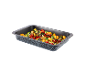 Dish of gnocchi, cherry tomatoes, and spinach in a rectangular baking dish