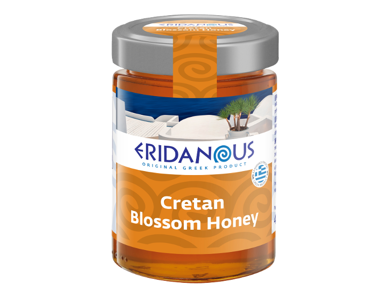Jar of Cretan blossom honey with a label depicting a Greek landscape.