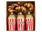 Christmas decorations shaped like tiger croissants and popcorn buckets with the word 'POPCORN'.
