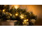 Christmas garland with warm white LED lights and artificial snow