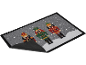 Christmas doormat with three nutcrackers, one black, one green, and one red, on a snowy background.