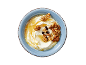 Greek yogurt with honey, walnuts, almonds, and raisins in a blue bowl.