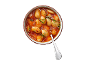 White beans in tomato sauce with rosemary in a bowl with a spoon