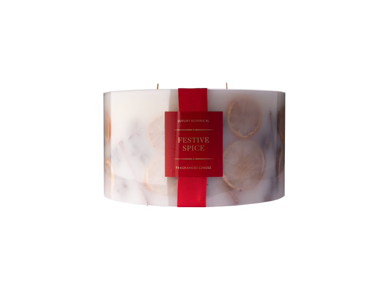 Luxury botanical fragranced candle Festive Spice decorated with orange slices.