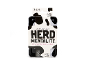 Herd Mentality board game in a black and white cow-patterned tin.