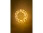 Golden LED light garland in ring shape, hanging from the ceiling.