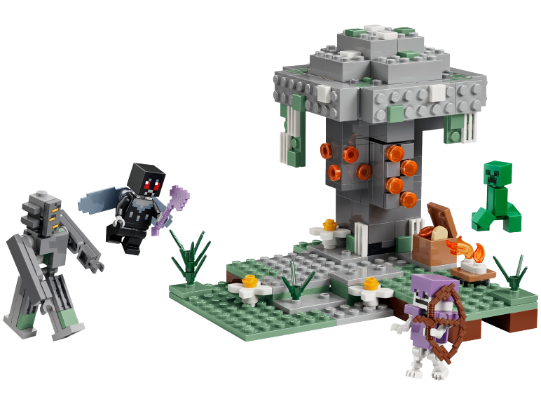 Play set with a grey tree, green creature, skeleton, and other figures.