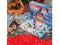 Girl playing with a toy advent calendar featuring a castle and figurines.