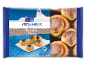 Package of Greek Roxakia in syrup sweets, with a Greek house background.