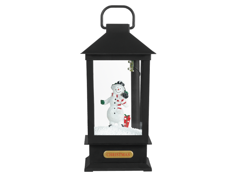 Black Christmas lantern with a snowman, gift, and the inscription «CHRISTMAS».